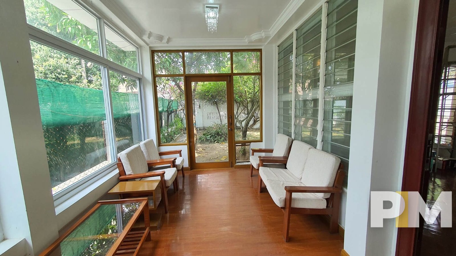 living room with wooden sofa - Rent in Yangon