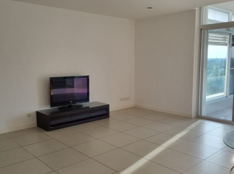 Living room with TV - Property in Yangon